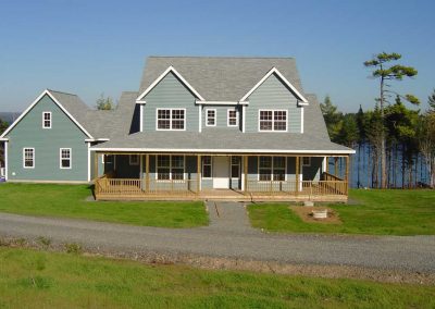 Double dormers, wraparound verandah and attached garage
